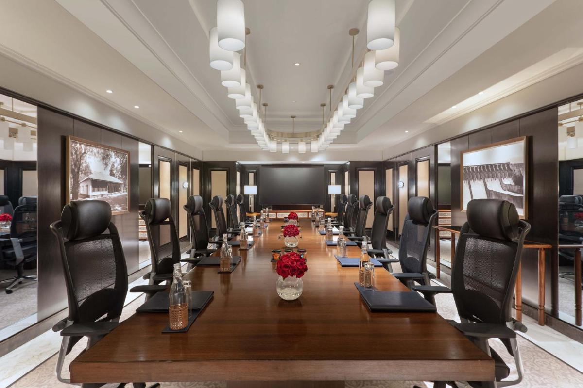 a large conference room with a long table and chairs at ITC Narmada, a Luxury Collection Hotel, Ahmedabad in Ahmedabad