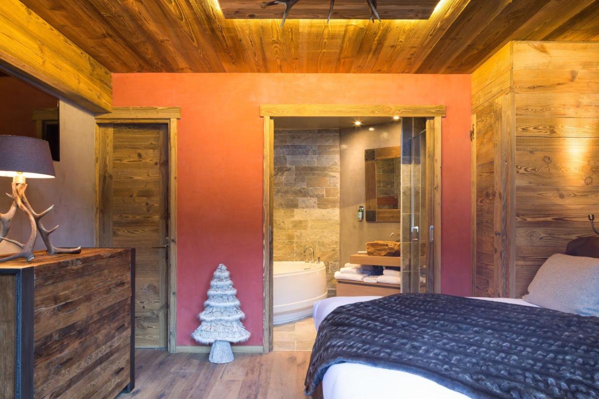 Un ou plusieurs lits dans un hébergement de l'établissement Les Grands Montets Hotel & Spa