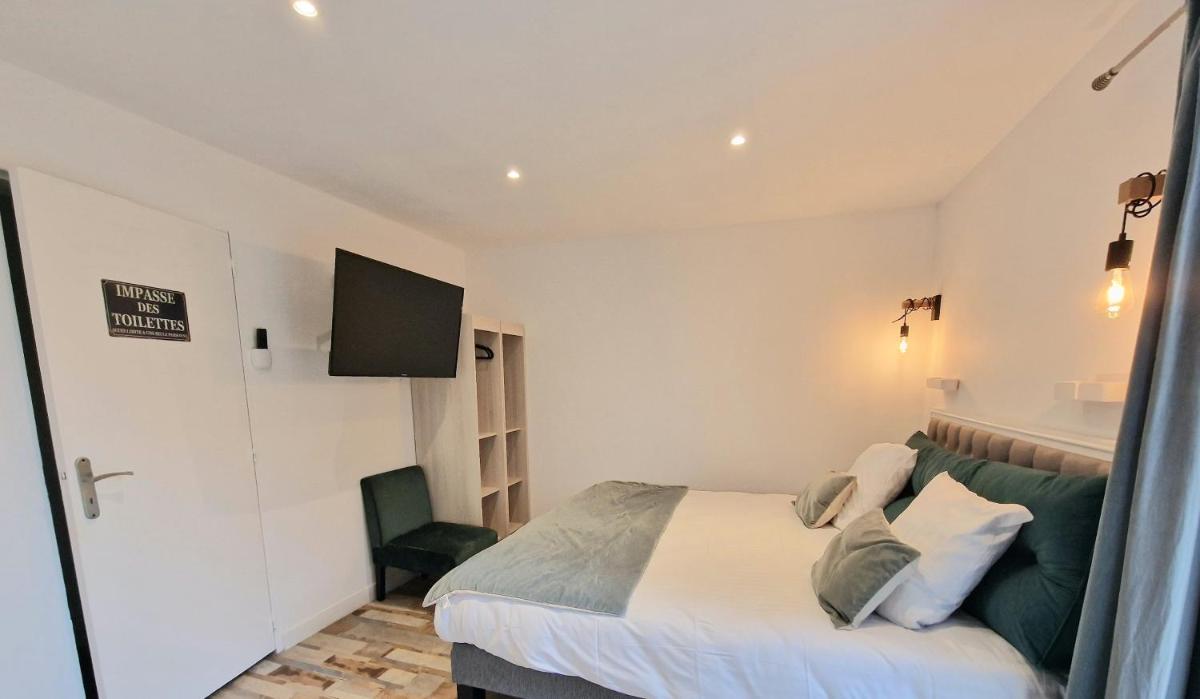 Un ou plusieurs lits dans un hébergement de l'établissement Les Terrasses de Saumur - Hôtel & Appartements - Restaurant & Spa (Logis)