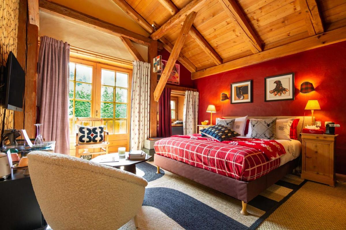 Un ou plusieurs lits dans un hébergement de l'établissement Magic Megève Bois