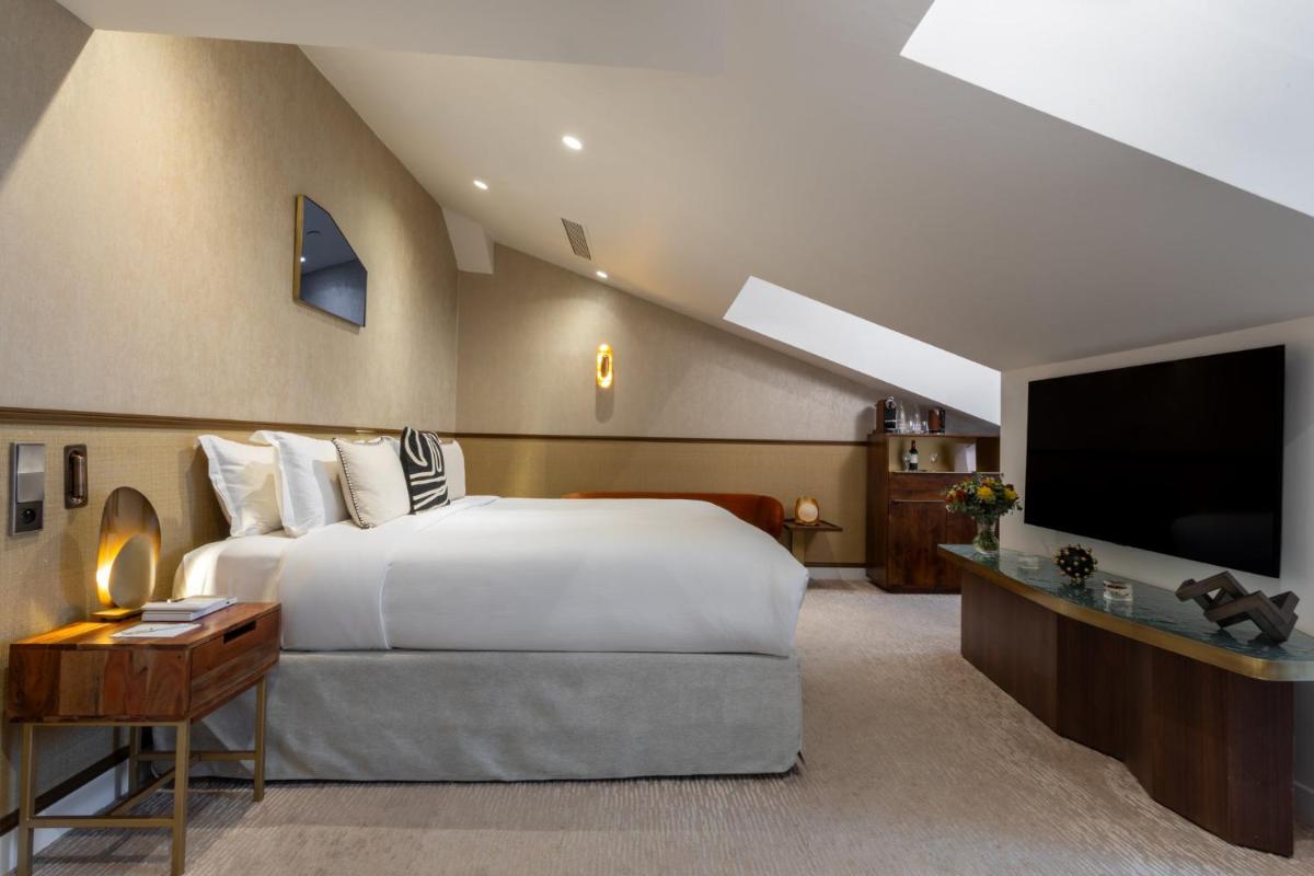 Un ou plusieurs lits dans un hébergement de l'établissement InterContinental Paris Champs Elysées Etoile by IHG