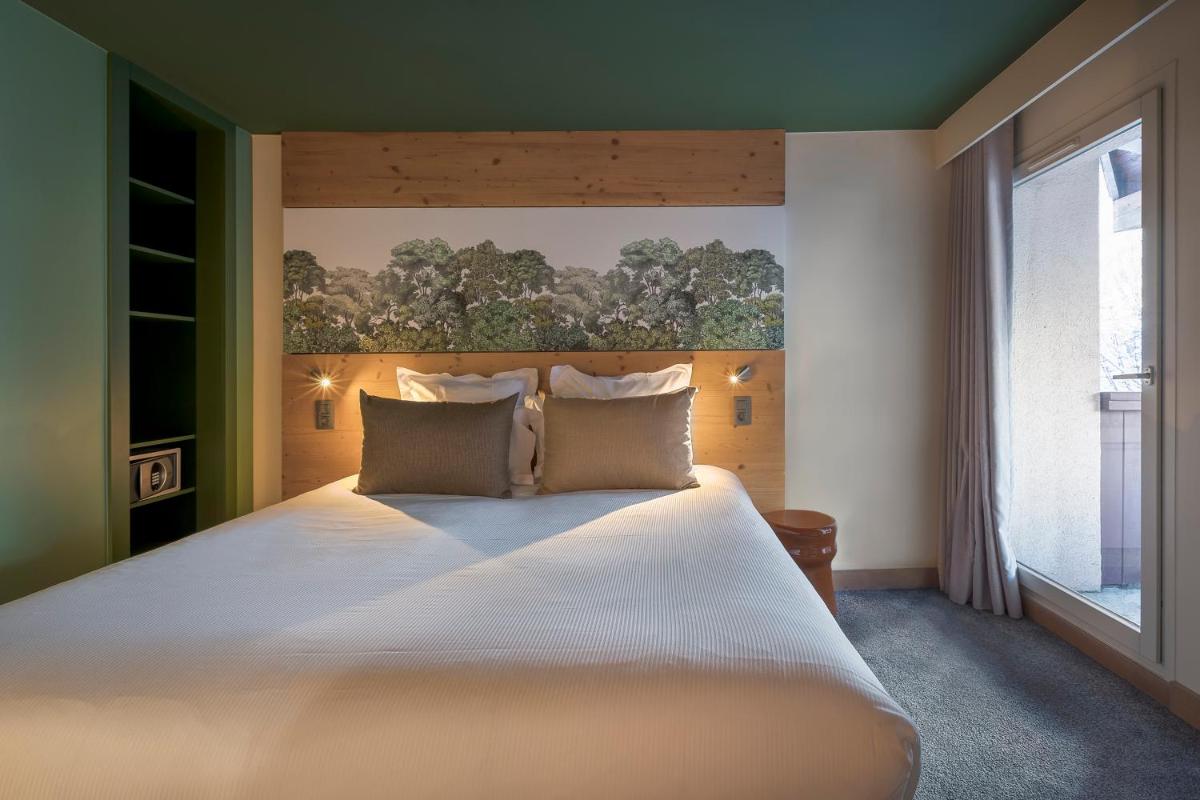 Un ou plusieurs lits dans un hébergement de l'établissement Lykke Hôtel & Spa Chamonix - ex Mercure