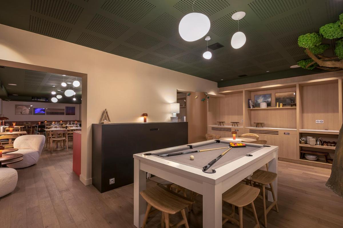 Télévision ou salle de divertissement dans l'établissement Lykke Hôtel & Spa Chamonix - ex Mercure