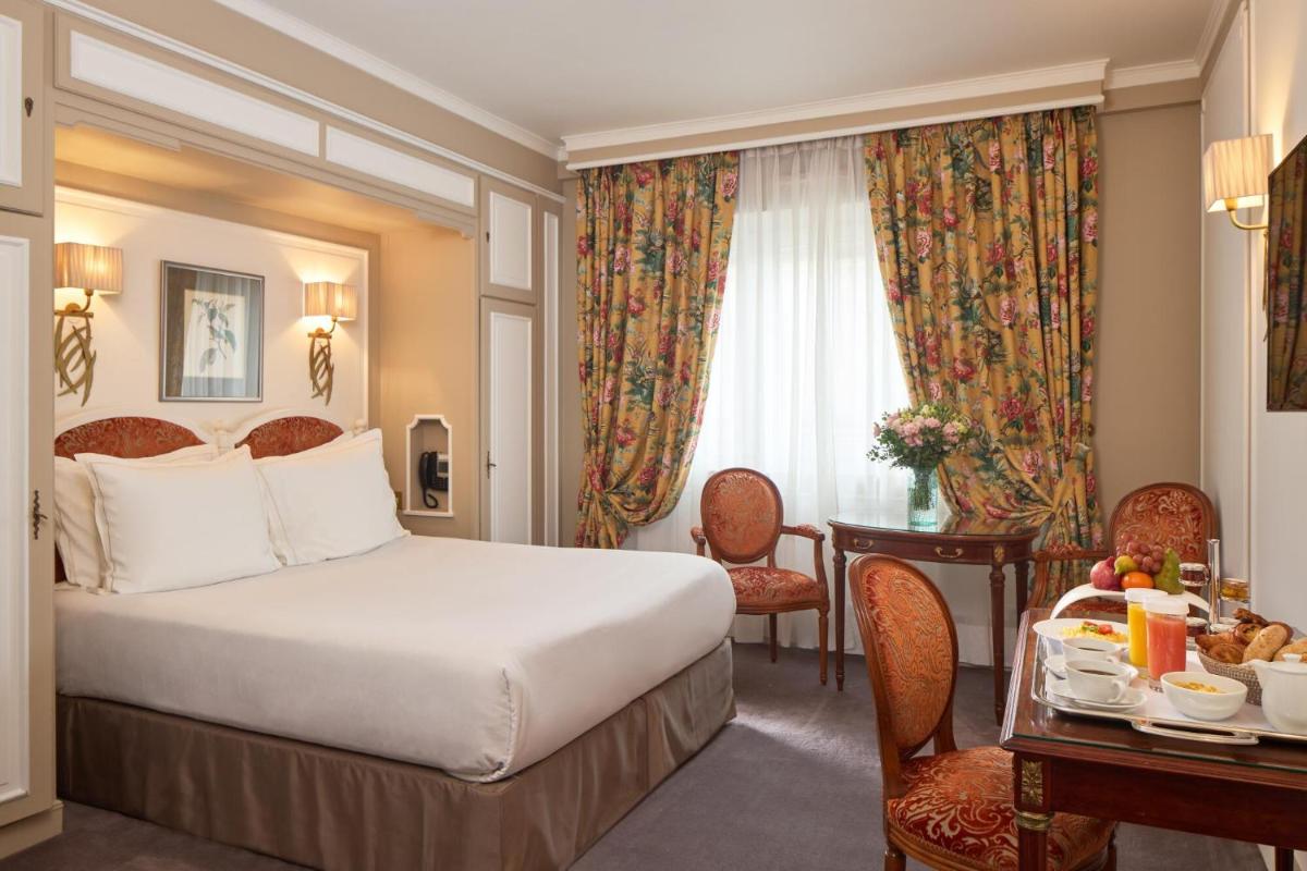 Un ou plusieurs lits dans un hébergement de l'établissement Majestic Hotel Spa - Champs Elysées
