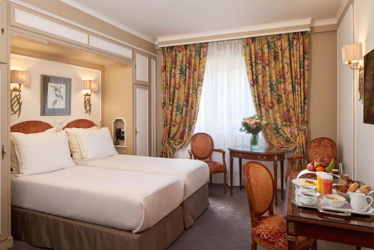 Un ou plusieurs lits dans un hébergement de l'établissement Majestic Hotel Spa - Champs Elysées