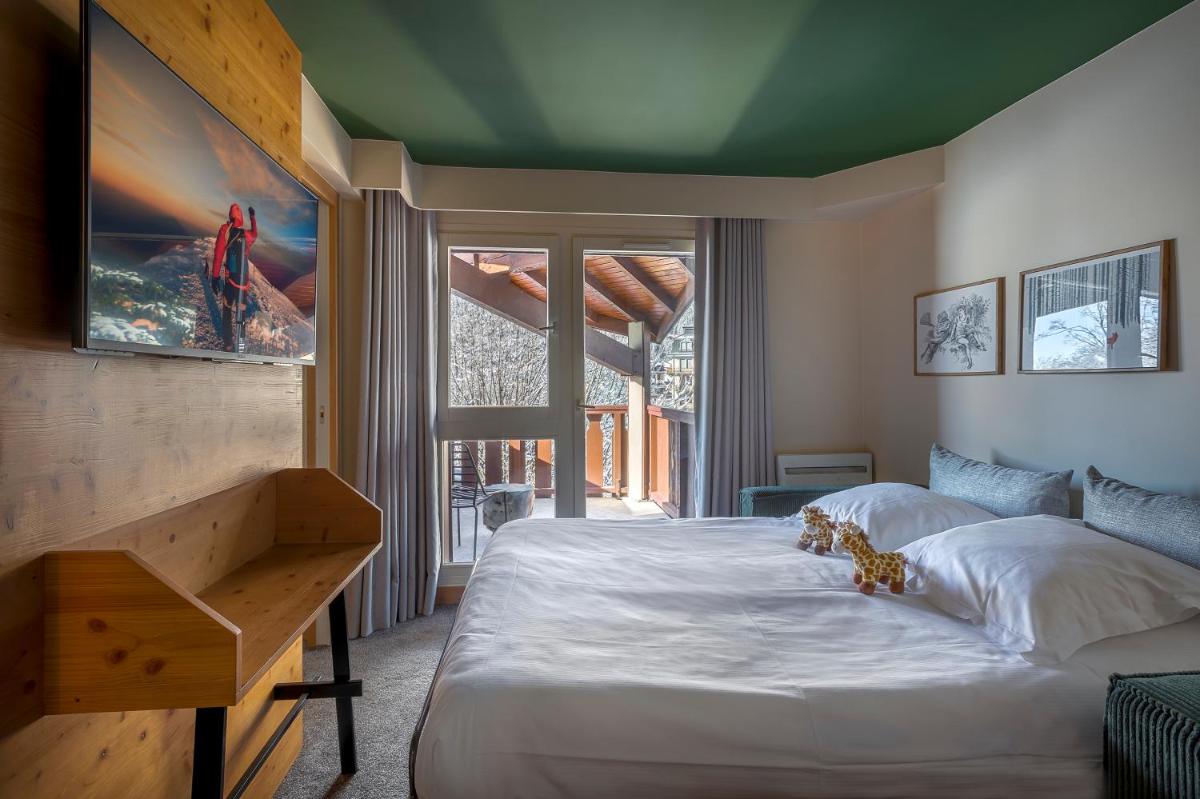 Un ou plusieurs lits dans un hébergement de l'établissement Lykke Hôtel & Spa Chamonix - ex Mercure