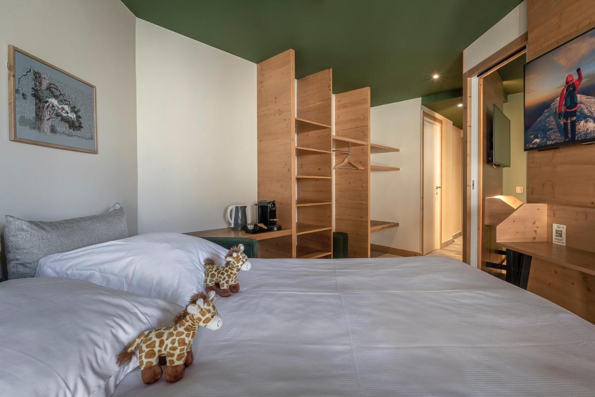 Un ou plusieurs lits dans un hébergement de l'établissement Lykke Hôtel & Spa Chamonix - ex Mercure