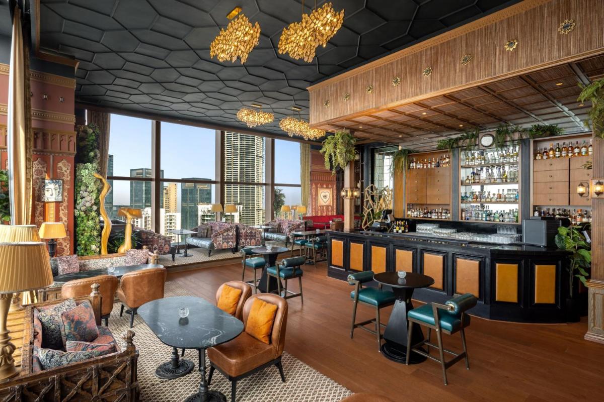 a bar with a view of the city at The St. Regis Mumbai in Mumbai