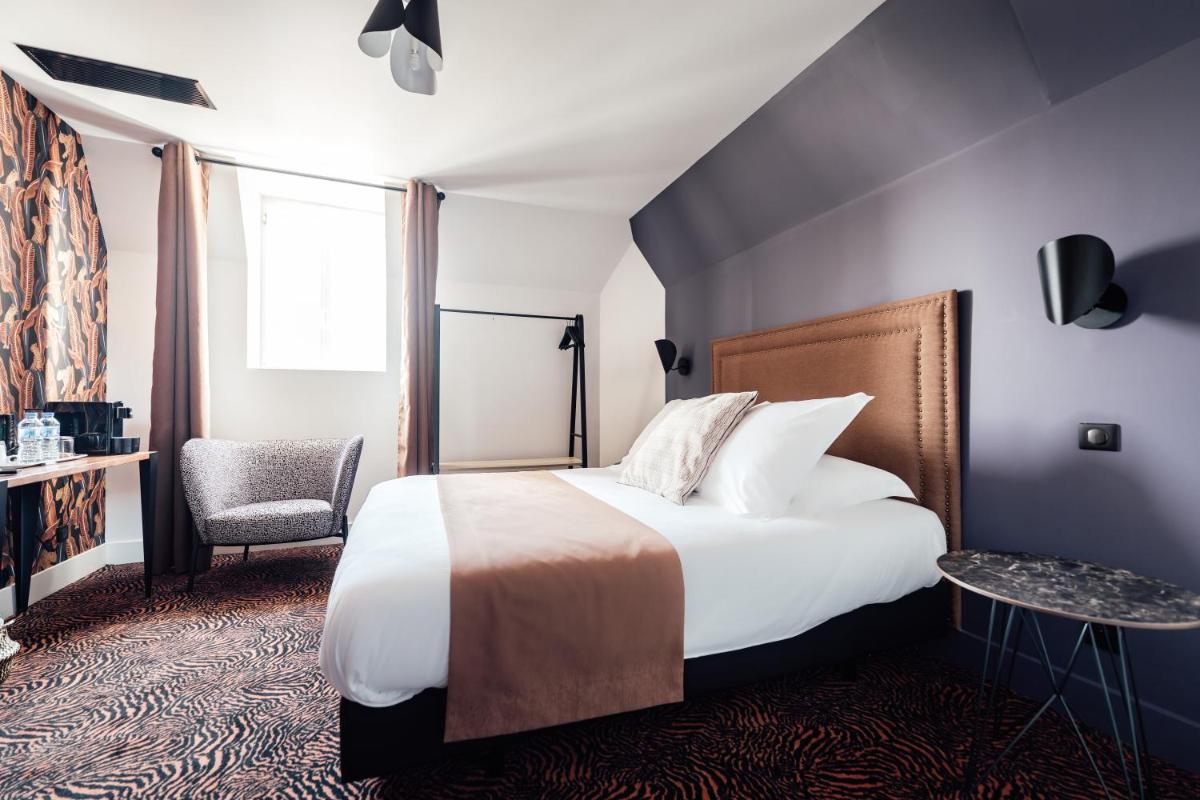 Un ou plusieurs lits dans un hébergement de l'établissement La villa 10 HÔTEL SPA