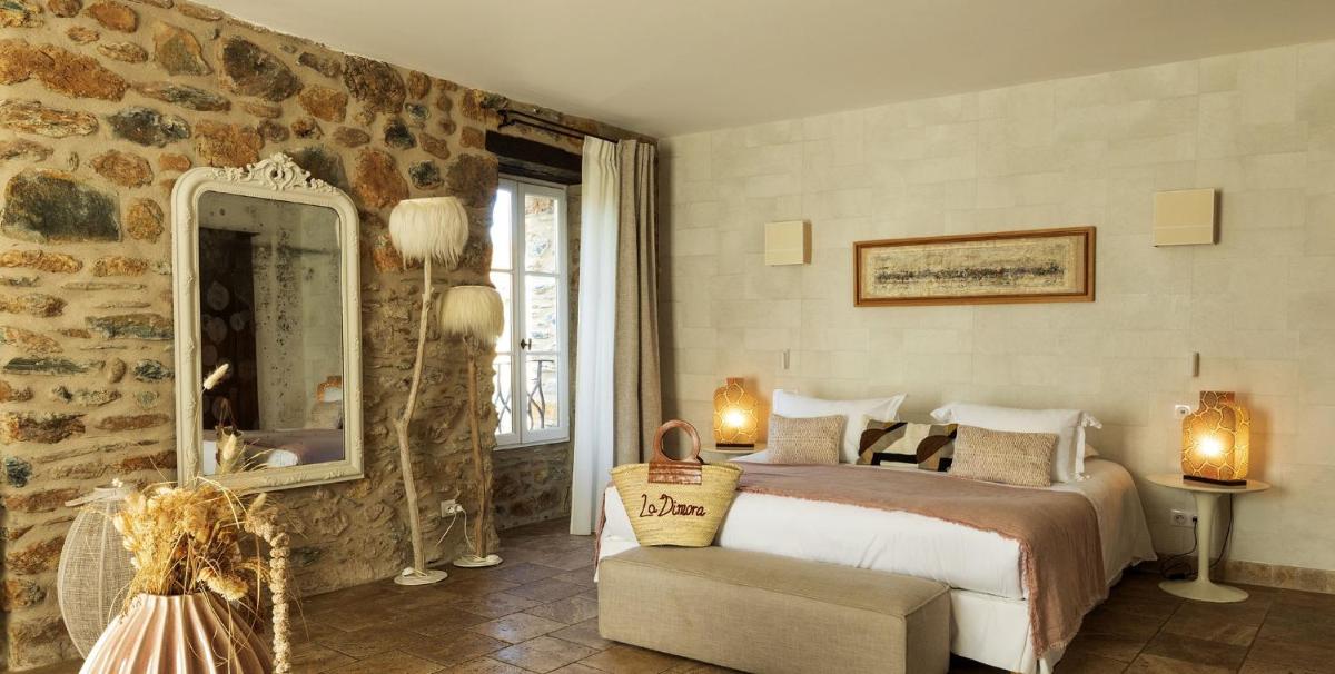 Un ou plusieurs lits dans un hébergement de l'établissement Hôtel La Dimora & Spa