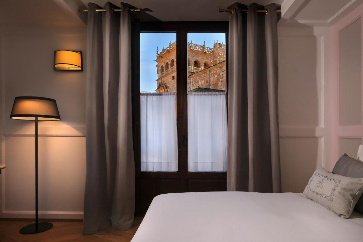 Cama o camas de una habitación en Eunice Hotel Gastronómico