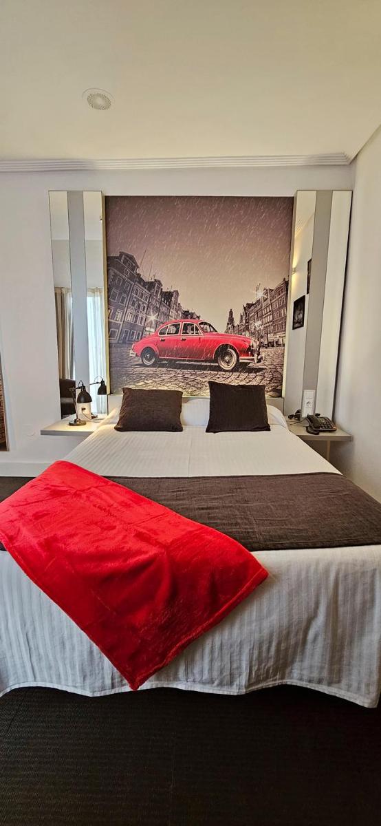 Cama o camas de una habitación en Hotel Spa El Muelle de Suances