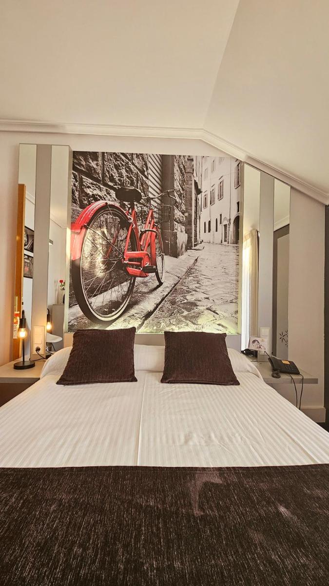 Cama o camas de una habitación en Hotel Spa El Muelle de Suances