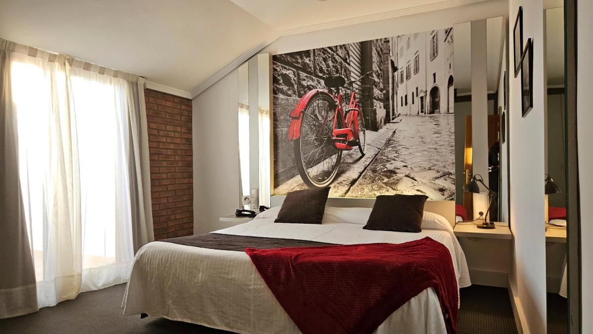 Cama o camas de una habitación en Hotel Spa El Muelle de Suances