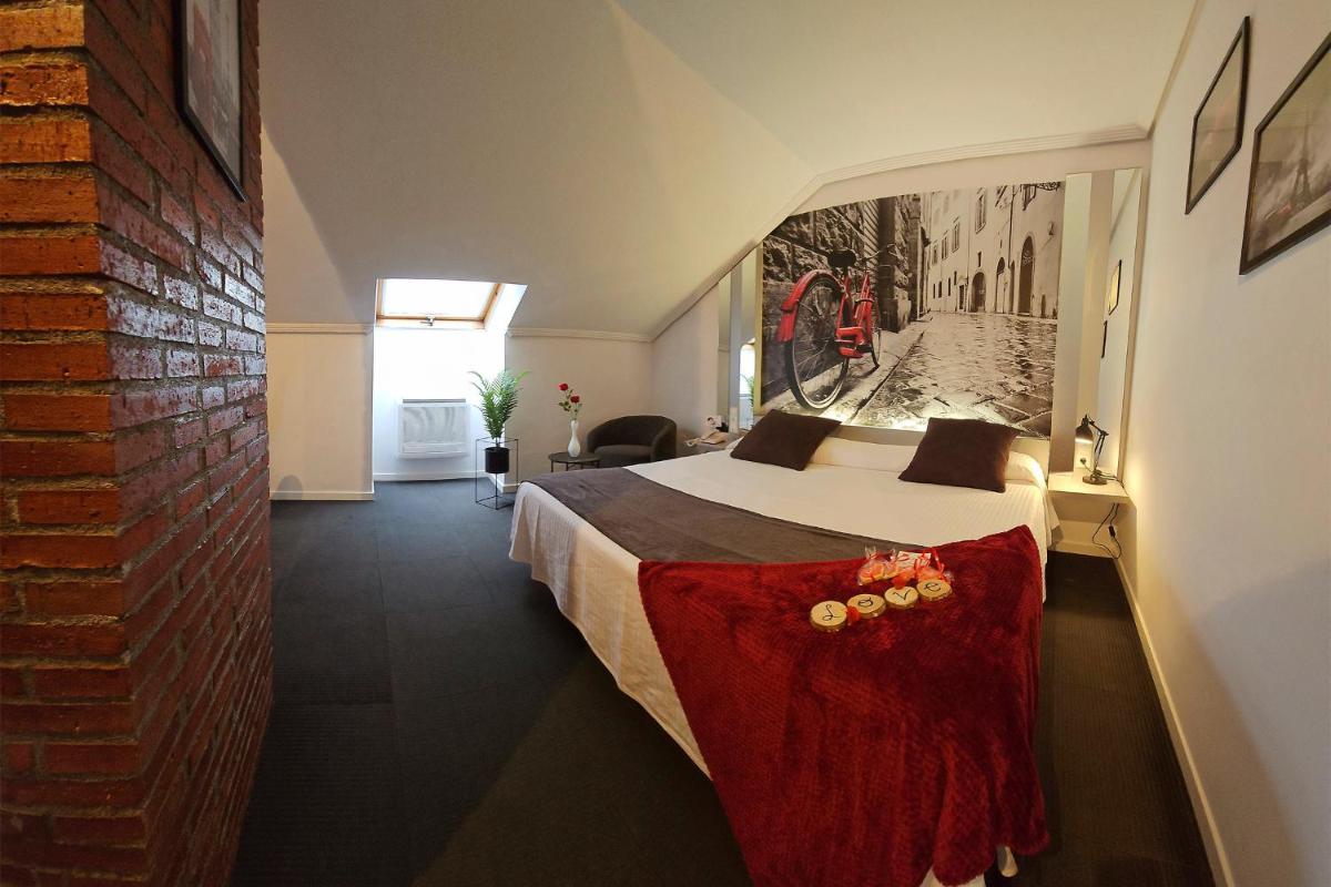 Cama o camas de una habitación en Hotel Spa El Muelle de Suances