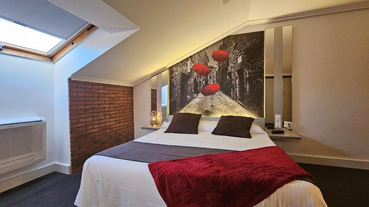 Cama o camas de una habitación en Hotel Spa El Muelle de Suances