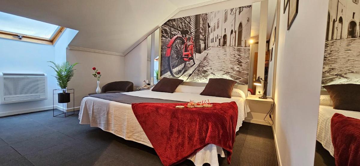 Cama o camas de una habitación en Hotel Spa El Muelle de Suances