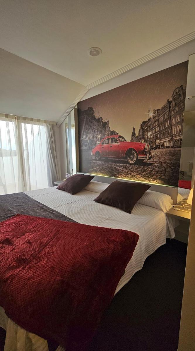 Cama o camas de una habitación en Hotel Spa El Muelle de Suances