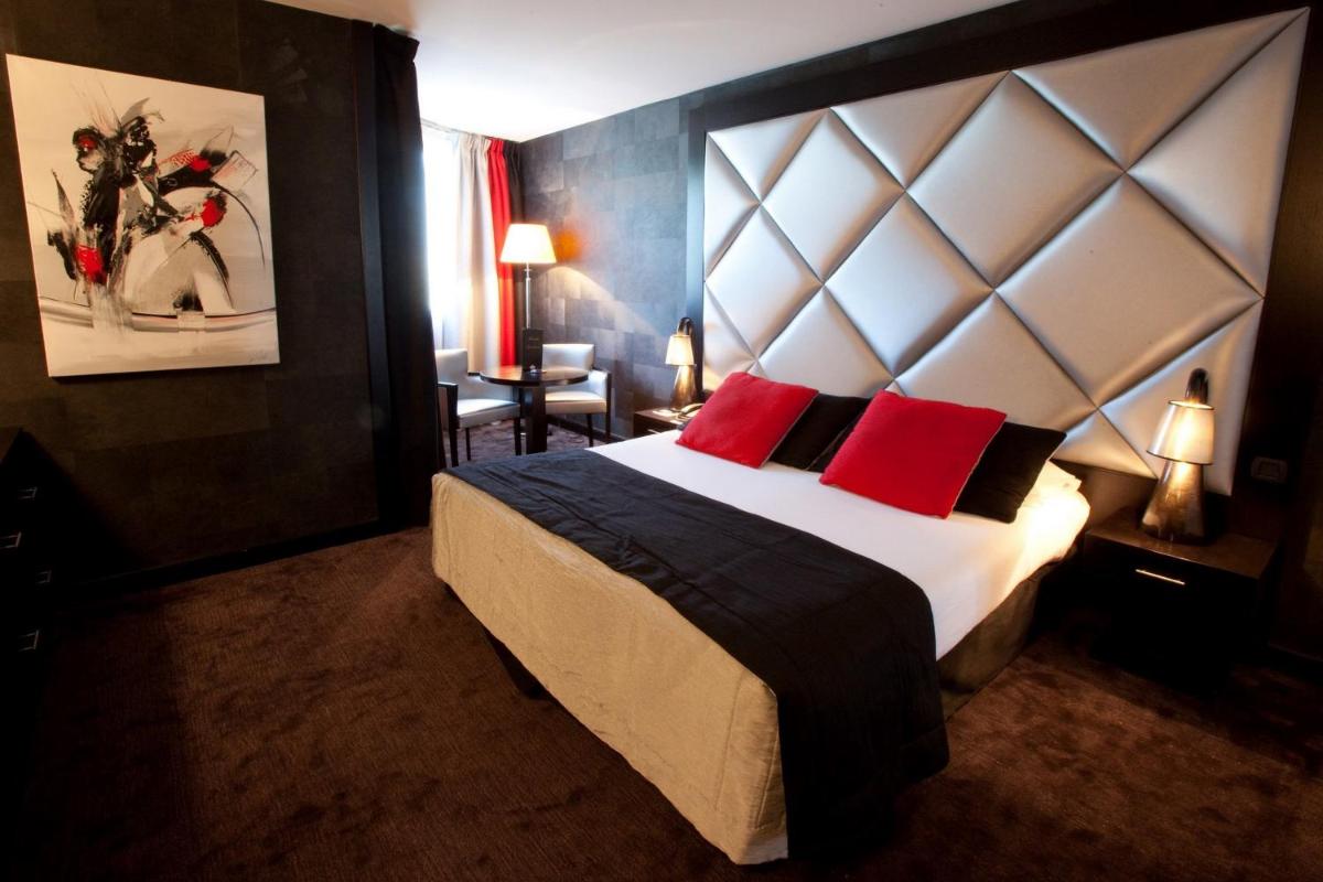 Un ou plusieurs lits dans un hébergement de l'établissement Hotel Palladia