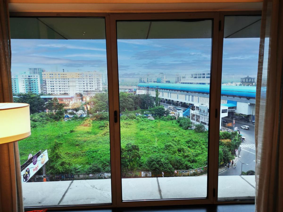 a view of a city from a window at Vivanta Kolkata EM Bypass in Kolkata