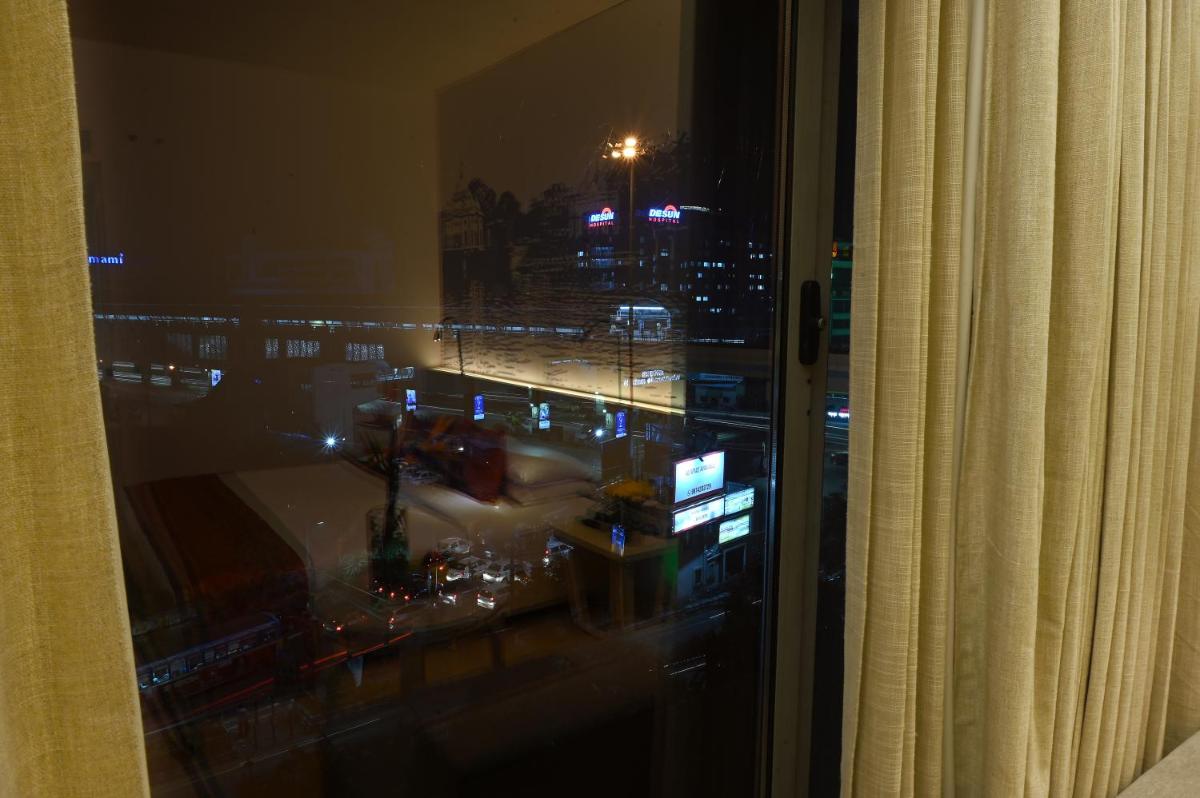a view of a city at night from a window at Vivanta Kolkata EM Bypass in Kolkata