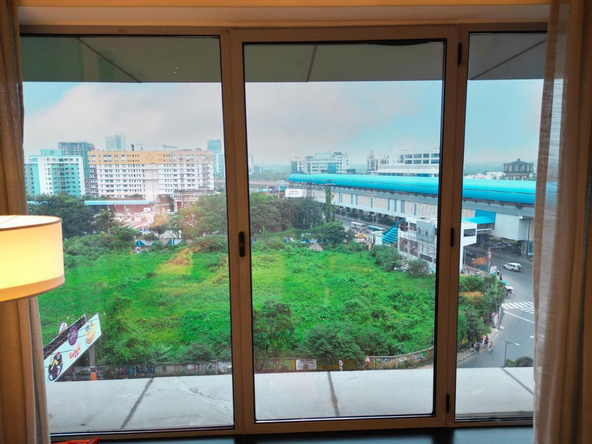 a view of a city from a window at Vivanta Kolkata EM Bypass in Kolkata