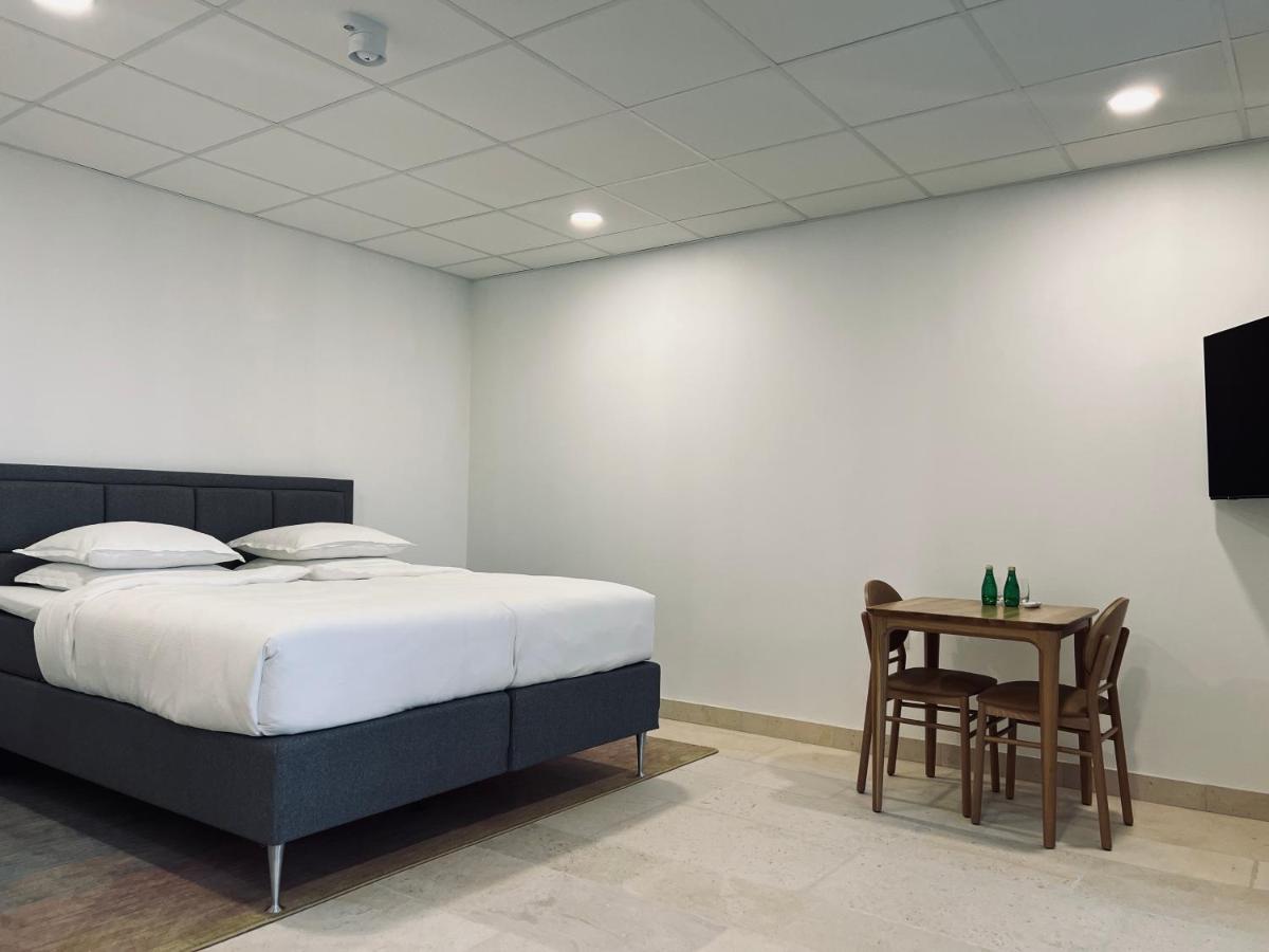 Un ou plusieurs lits dans un hébergement de l'établissement Château Lecusse - La Grande Roche - Hôtel, Spa, Boutique & Restaurant