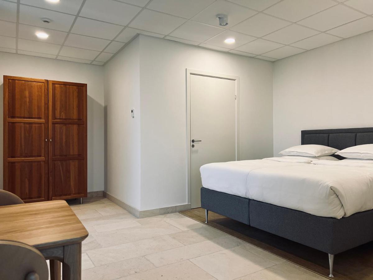 Un ou plusieurs lits dans un hébergement de l'établissement Château Lecusse - La Grande Roche - Hôtel, Spa, Boutique & Restaurant