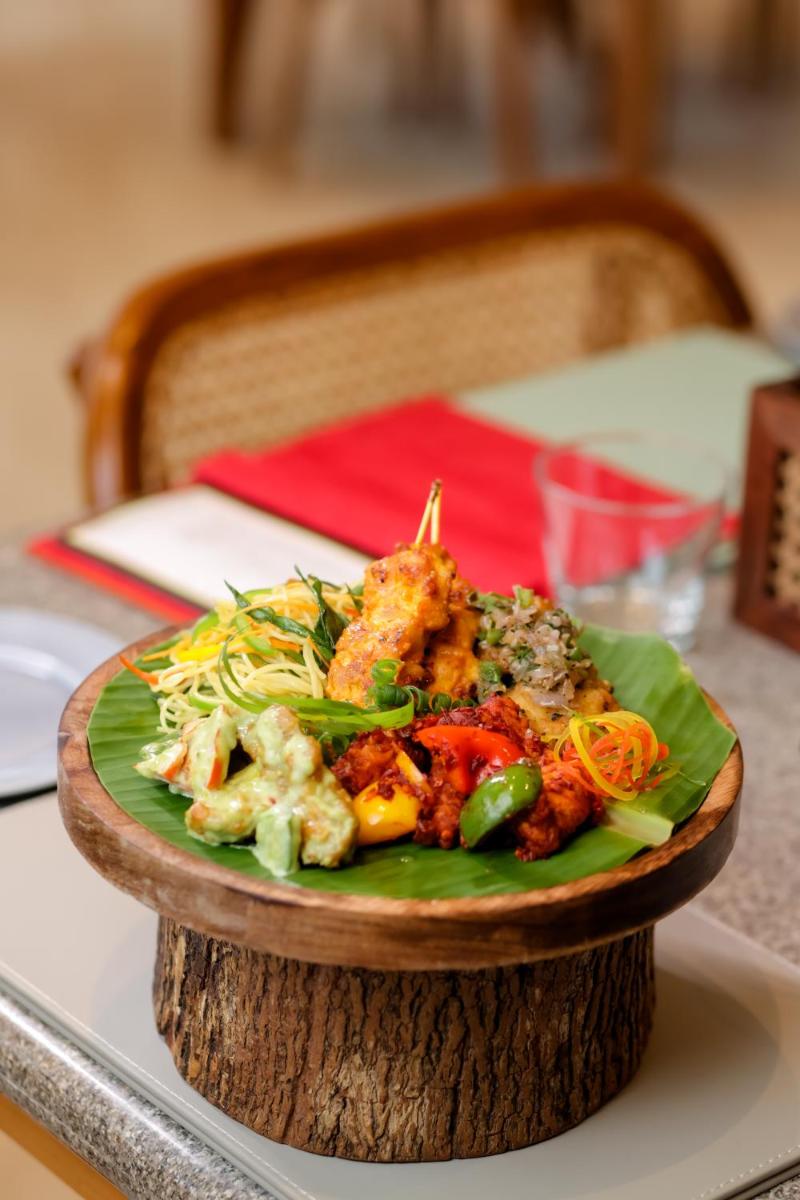a plate of food on top of a table at The Prominence Mussoorie Road Dehradun in Dehradun
