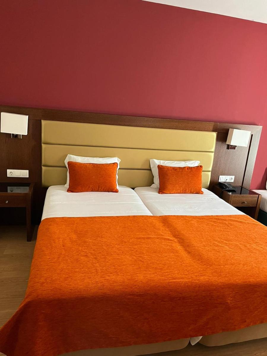 Uma cama ou camas num quarto em Palace Hotel & SPA Termas do Bicanho