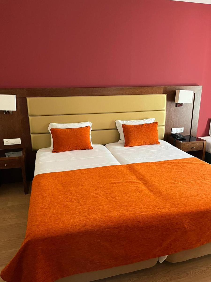 Uma cama ou camas num quarto em Palace Hotel & SPA Termas do Bicanho