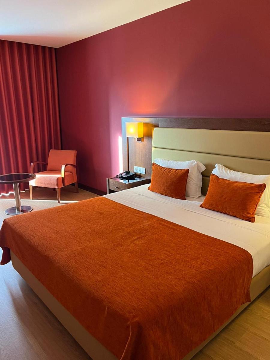 Uma cama ou camas num quarto em Palace Hotel & SPA Termas do Bicanho