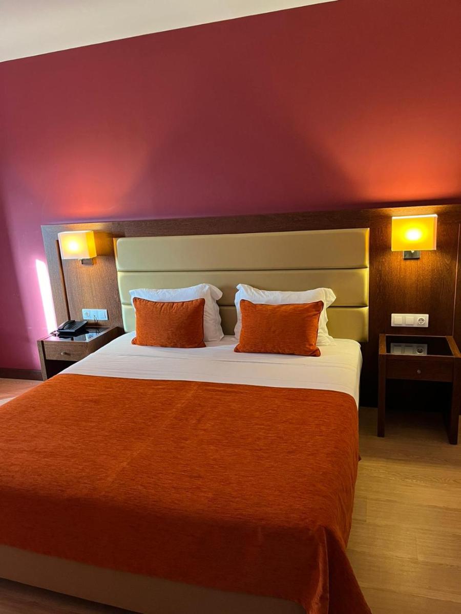 Uma cama ou camas num quarto em Palace Hotel & SPA Termas do Bicanho