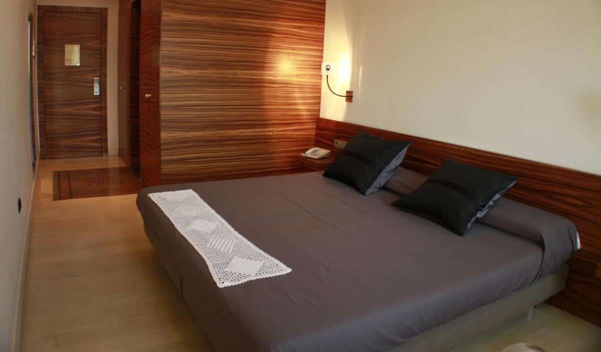 Cama o camas de una habitación en Hotel Sant Roc