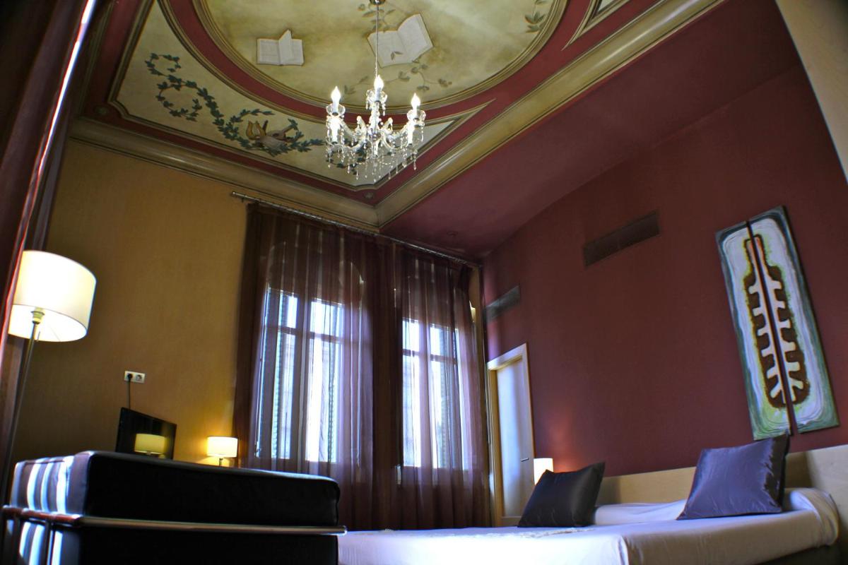 Cama o camas de una habitación en Hotel Sant Roc