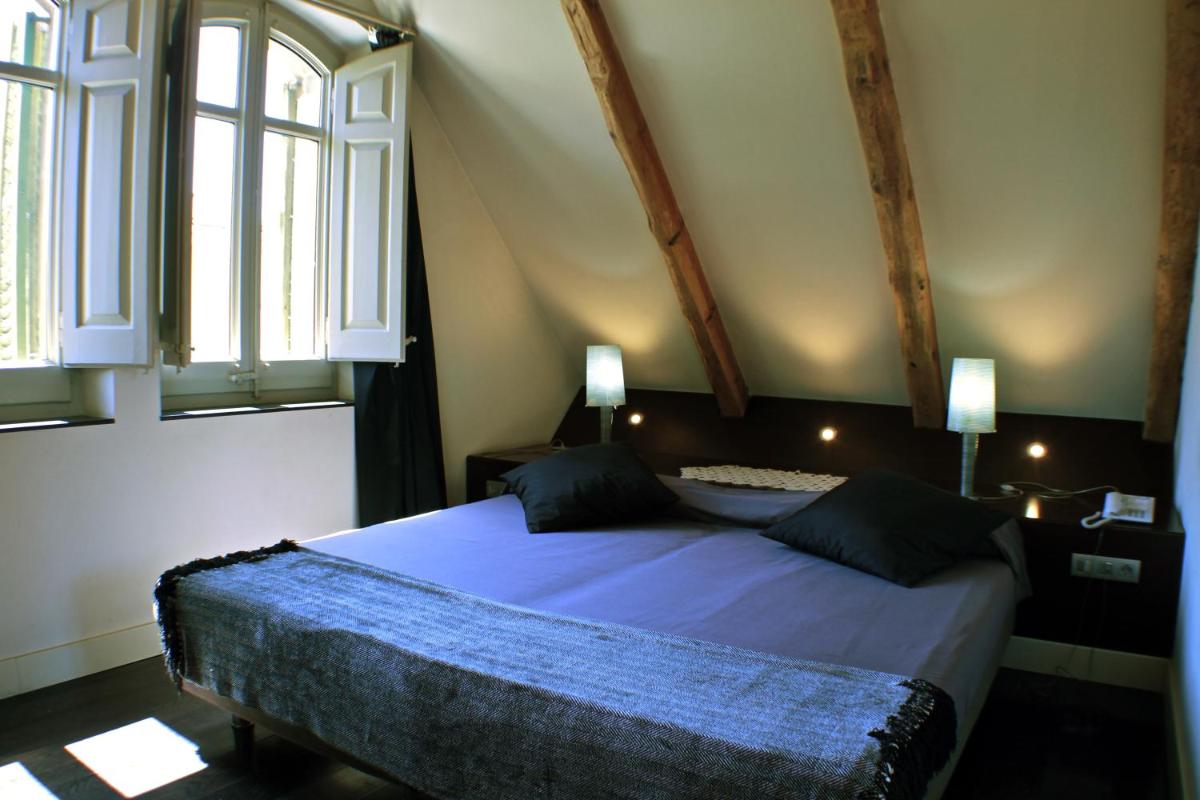 Cama o camas de una habitación en Hotel Sant Roc