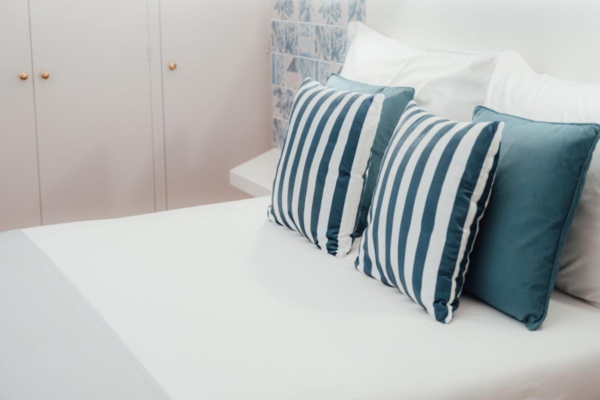 Uma cama ou camas num quarto em Sé Boutique Hotel