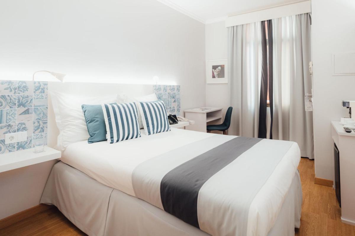 Uma cama ou camas num quarto em Sé Boutique Hotel