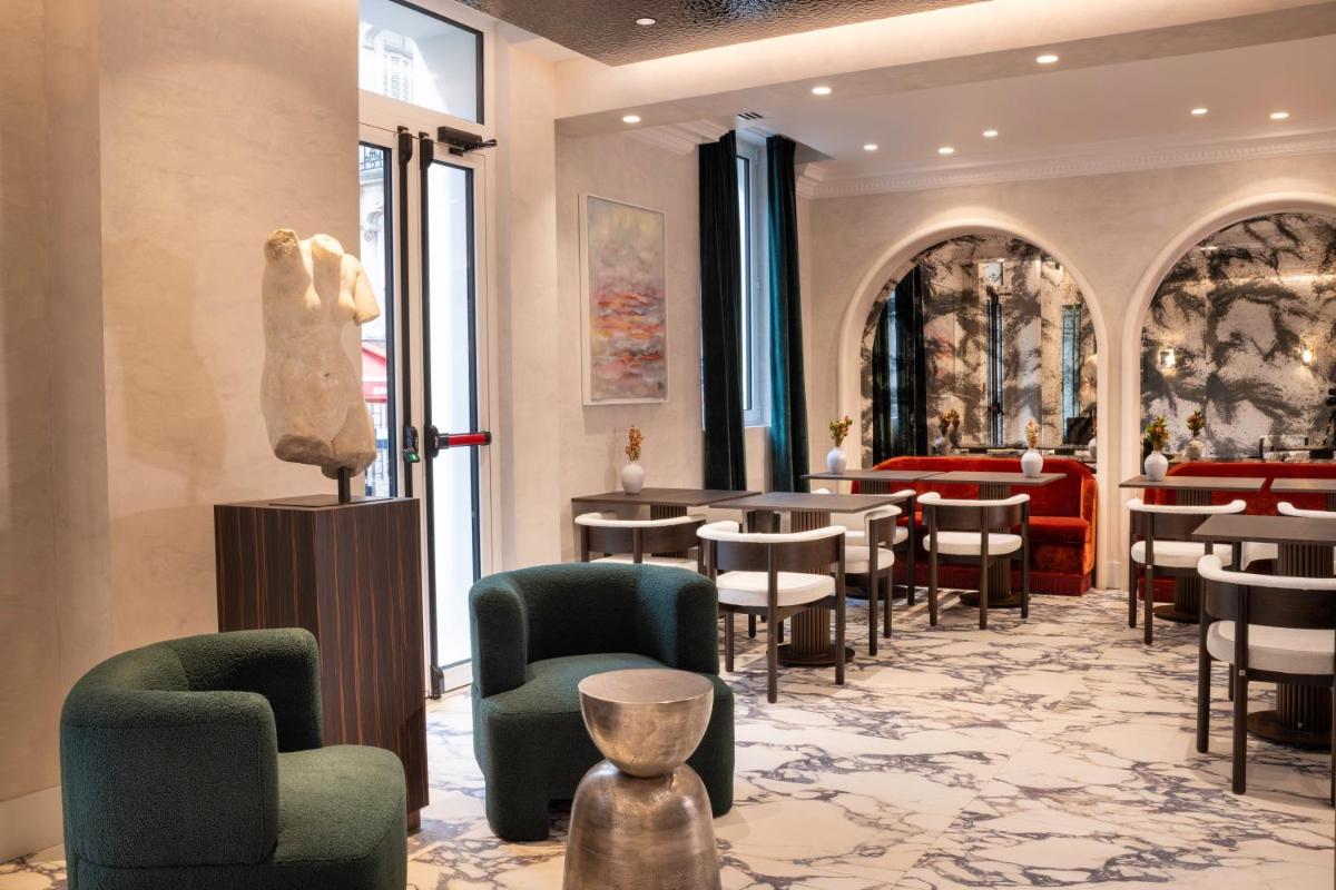 Coin salon dans l'établissement Hotel des Carmes by Malone