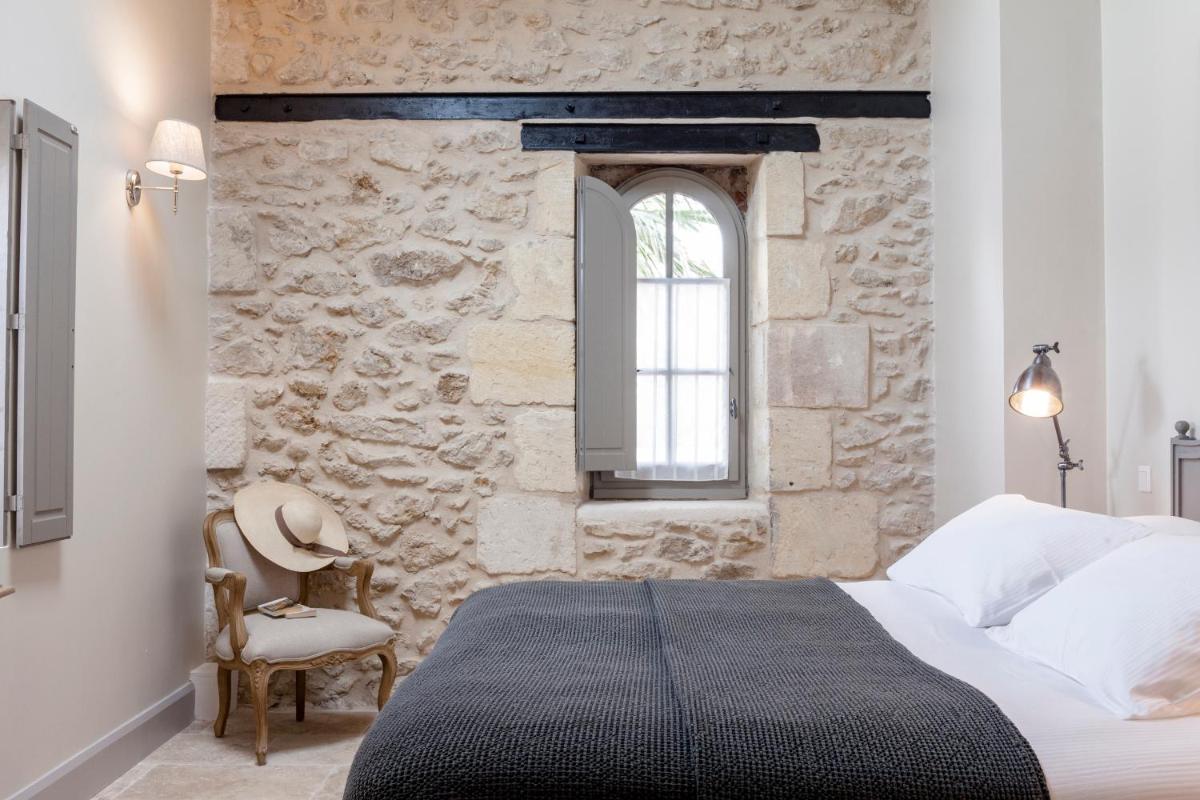 Un ou plusieurs lits dans un hébergement de l'établissement Château St Pierre de Serjac