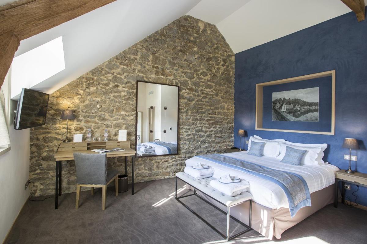 Un ou plusieurs lits dans un hébergement de l'établissement Hotel de L'Abbaye Le Tronchet - Handwritten Collection