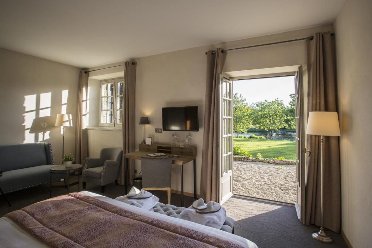 Un ou plusieurs lits dans un hébergement de l'établissement Hotel de L'Abbaye Le Tronchet - Handwritten Collection