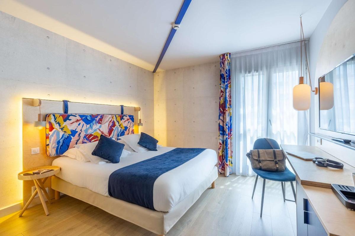 Un ou plusieurs lits dans un hébergement de l'établissement Urban Hotel & Spa Aix-les-Bains - BW Signature Collection