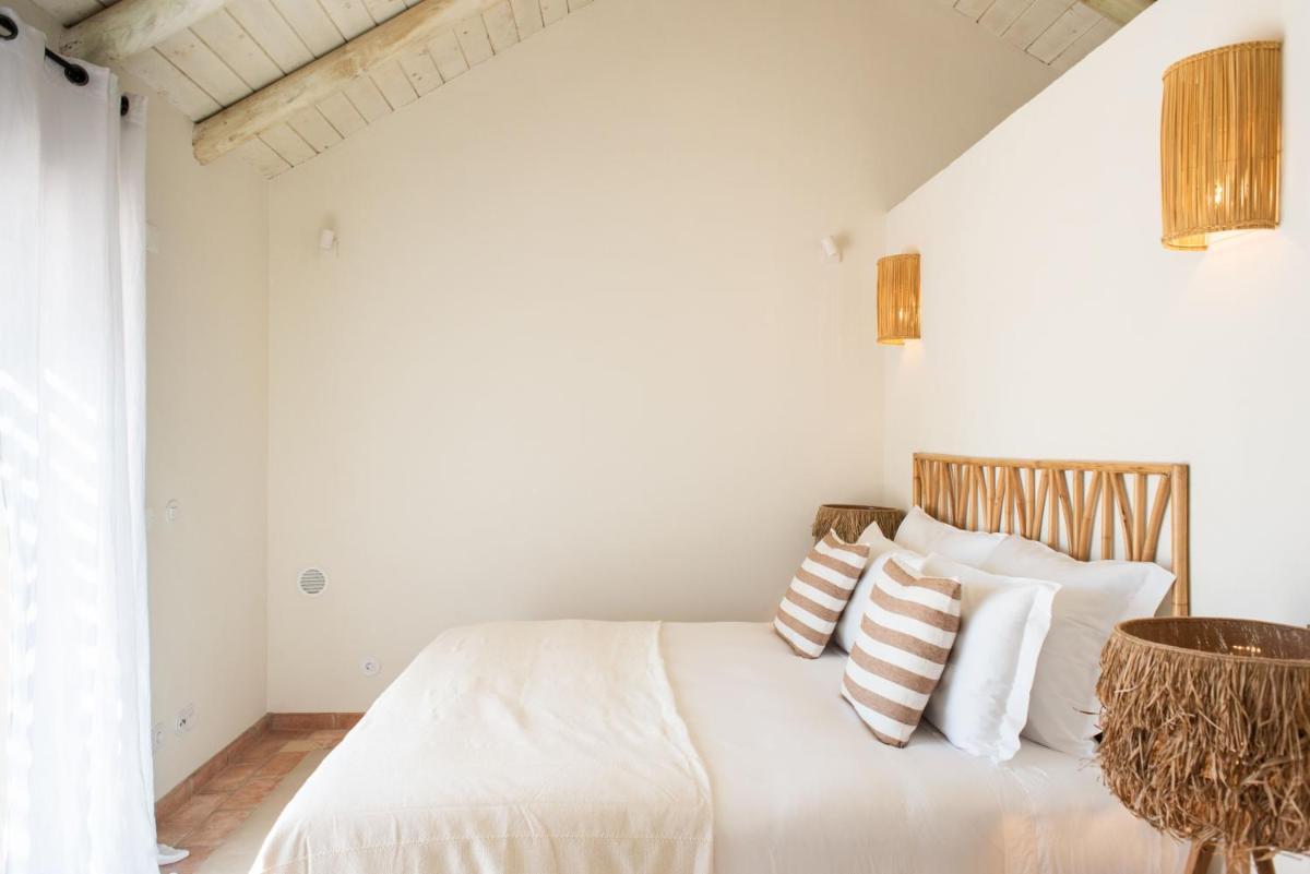 Uma cama ou camas num quarto em Independente Comporta