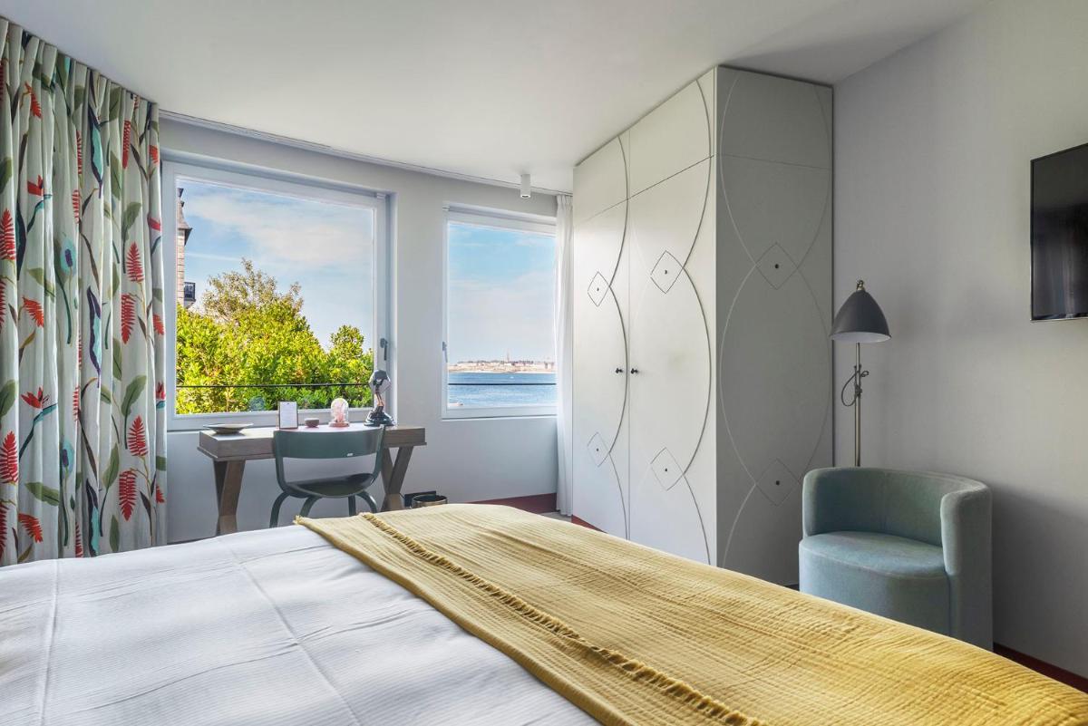 Un ou plusieurs lits dans un hébergement de l'établissement Castelbrac Hotel & Spa