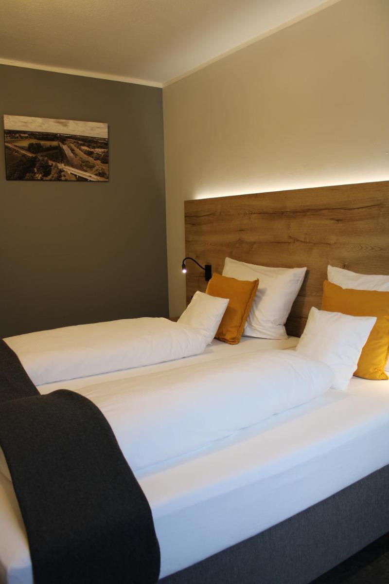 Ein Bett oder Betten in einem Zimmer der Unterkunft Motel Hasetal