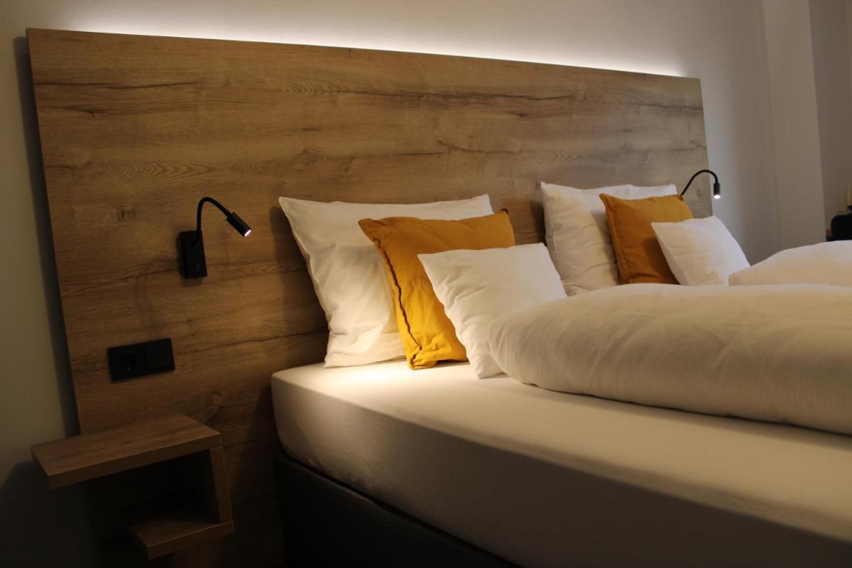 Ein Bett oder Betten in einem Zimmer der Unterkunft Motel Hasetal