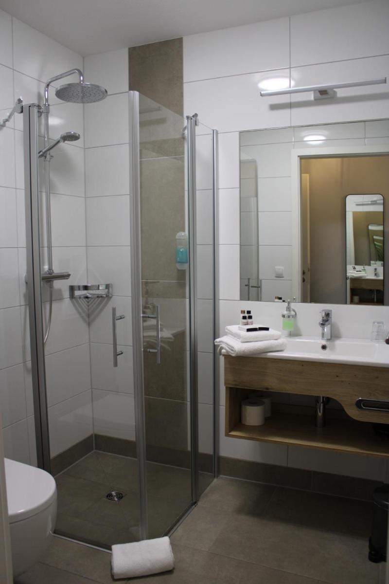 Ein Badezimmer in der Unterkunft Motel Hasetal