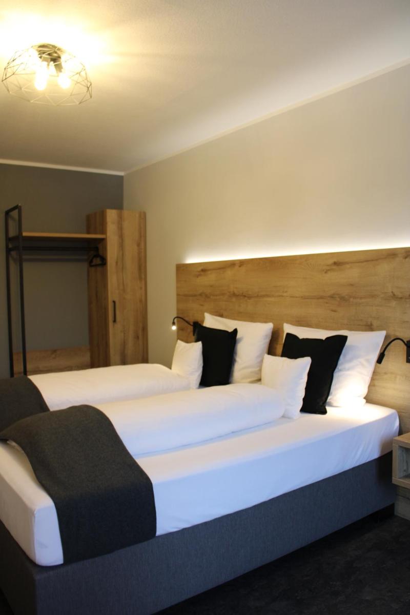 Ein Bett oder Betten in einem Zimmer der Unterkunft Motel Hasetal