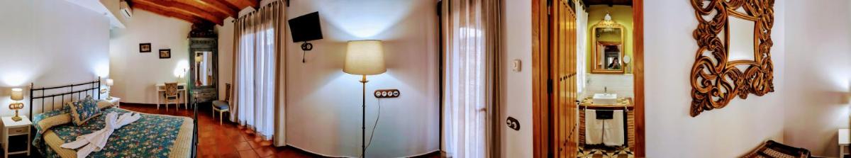 Una televisión o centro de entretenimiento en Casa El Descanso Del Peregrino